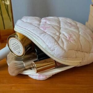 Mini pale pink bow makeup pouch